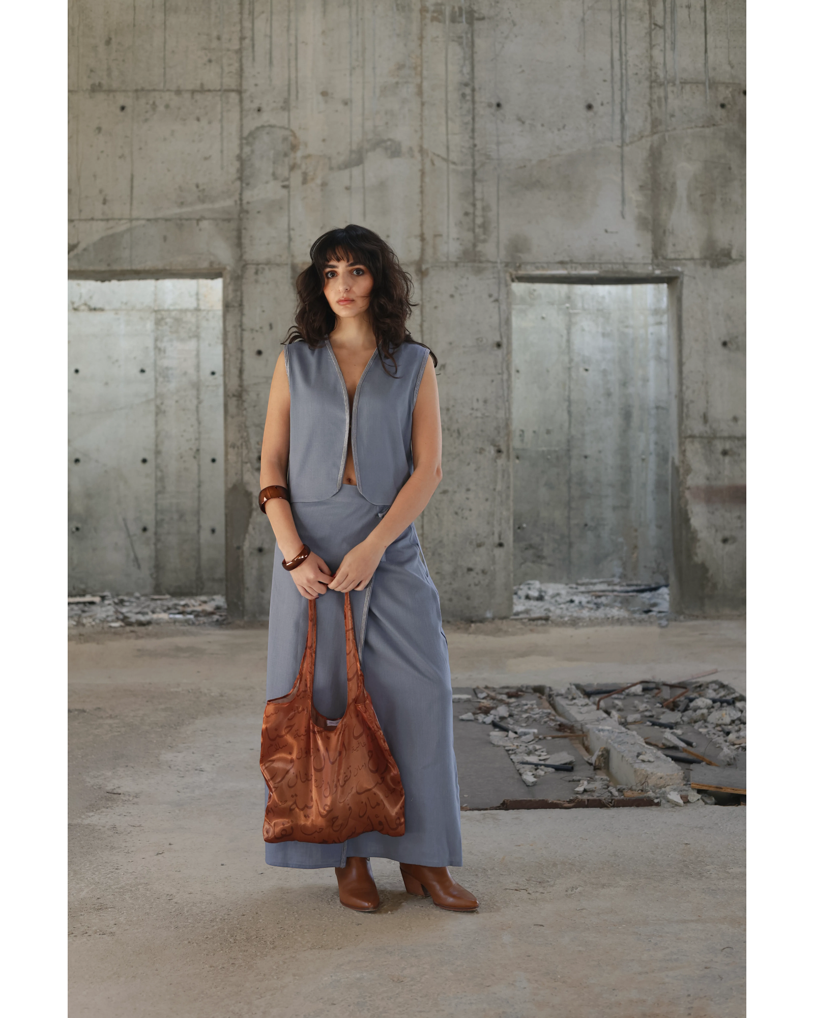 Farah Daylac burnt copper sheer tote bag with Arabic calligraphy print. A stylish accessory for everyday use.