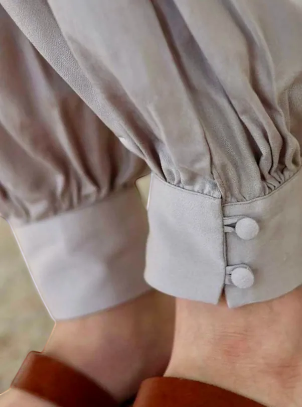 Farah Daylac taupe sherwal pants with gathered ankle cuffs and two fabric-covered buttons.